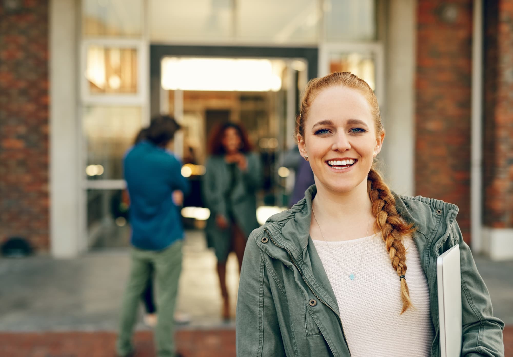 woman smiling in hallway
